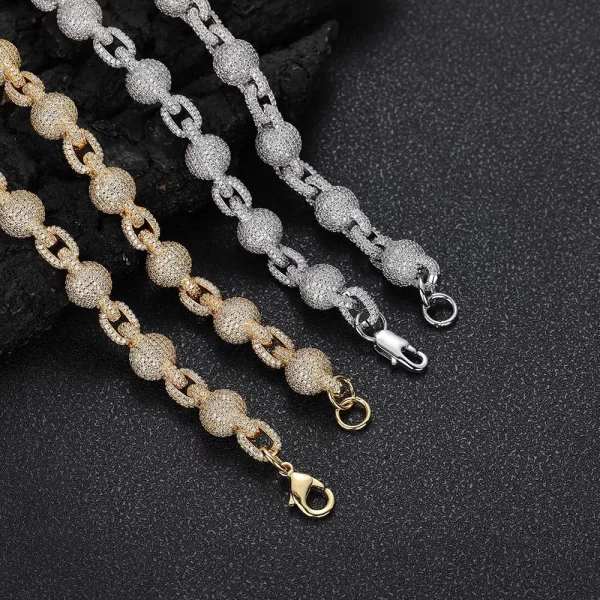 Elevate your look with the Iced Beaded Rolo Chain in White Gold. This 11mm chain features an intricate beaded design, set with VVS Simulated Diamonds for maximum brilliance. The White Gold finish brings a sleek and sophisticated touch, perfect for both casual and formal occasions. Whether worn alone or layered with other chains, this piece adds a modern twist to your style while offering durability and shine.