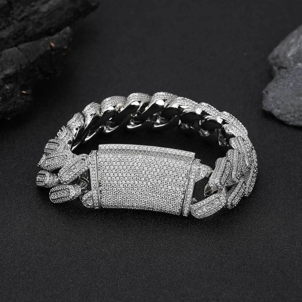 The Iced Square Diamond Miami Cuban Link Bracelet in White Gold - 18mm brings luxurious style and sparkle to any Hip Hop look. Featuring square-set VVS Simulated Diamonds, this 18mm wide bracelet ensures a commanding presence. The White Gold finish adds a refined touch, making it suitable for both everyday Hip Hop wear and special occasions.