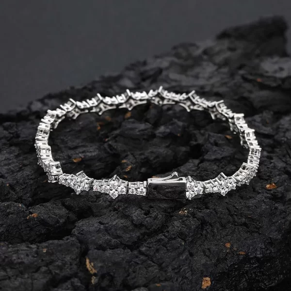 Add a touch of faith and bling to your collection with the Iced Cross Tennis Bracelet in White Gold - 7mm. Prong-set VVS Simulated Diamonds form a unique cross motif, delivering unmatched sparkle and symbolism. The 7mm width adds boldness, while the White Gold Plating ensures a luxurious and durable finish, perfect for both casual and formal settings.