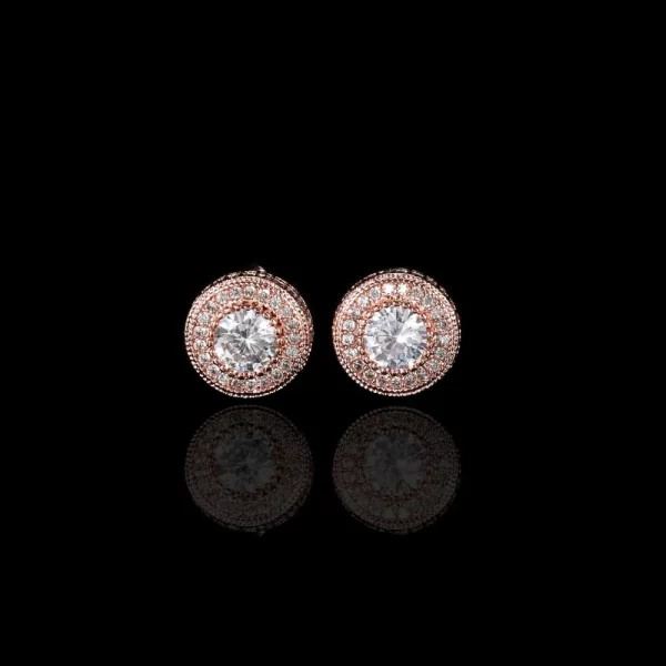 The Rose Gold Circle Prong Stud Earring brings a soft, refined touch to any look. Featuring diamond-simulated stones that shimmer with every movement, this earring blends a classic design with the warm tones of Rose Gold. Perfect for those who love Hip Hop fashion but want something a bit softer and more sophisticated, this piece is a versatile addition to any jewelry collection.