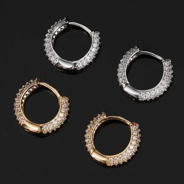 Upgrade your style with the Iced Hoop Earring - 15mm. The 15mm size strikes the perfect balance between subtle and bold, and the gold-plated finish ensures it won't fade. Adorned with diamond-simulated stones, these hoops offer the perfect mix of street style and luxury, ideal for any Hip Hop enthusiast. Whether you're dressing up or keeping it casual, these earrings are the perfect addition to your jewelry collection, adding just the right amount of shine and edge.