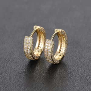 Double up on the shine with these 2 Layer Iced Hoop Earrings. Measuring 11mm, these hoops feature two layers of simulated diamonds that catch the light from every angle. The gold-plated finish ensures these hoops stay bright and eye-catching for any occasion. Whether for daily wear or special events, these hoops are perfect for those who want to add some serious Hip Hop bling to their look.