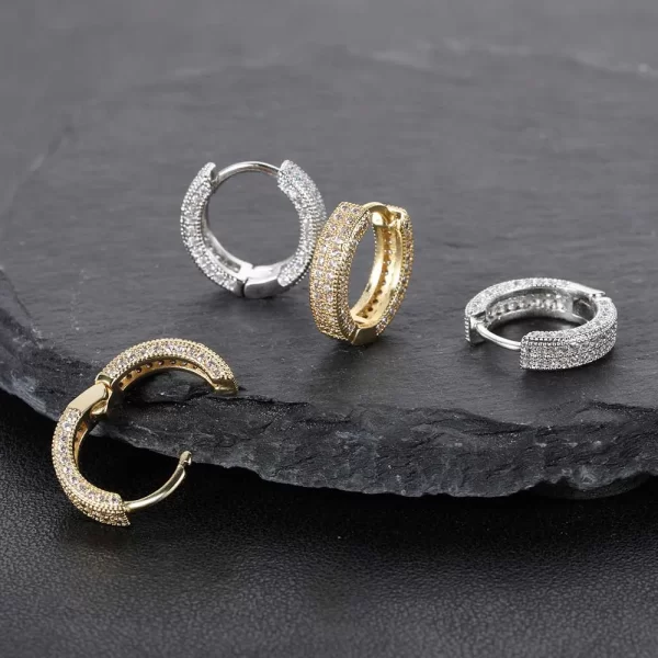 Double up on the shine with these 2 Layer Iced Hoop Earrings. Measuring 11mm, these hoops feature two layers of simulated diamonds that catch the light from every angle. The gold-plated finish ensures these hoops stay bright and eye-catching for any occasion. Whether for daily wear or special events, these hoops are perfect for those who want to add some serious Hip Hop bling to their look.