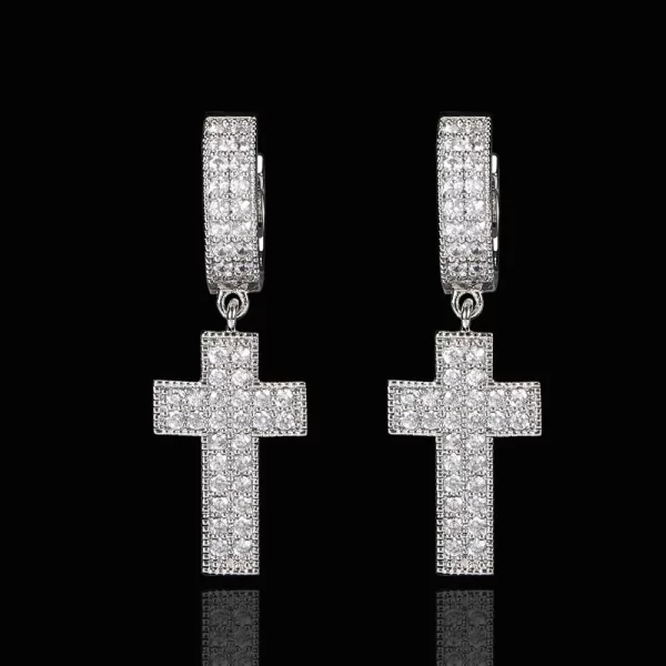 The Iced Cross Hanging Earrings in White Gold are perfect for those who love to combine faith with fashion. With their sleek White Gold-plated finish and sparkling simulated diamonds, these earrings add a touch of elegance to the bold cross design. Ideal for both casual and formal occasions, they bring a spiritual edge to any Hip Hop-inspired look.