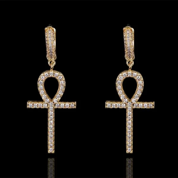 Make a bold statement with these Iced Ankh Cross Hanging Earrings. The iconic Ankh cross symbolizes life, and with the gold-plated finish and simulated diamonds, these earrings deliver a unique blend of style and meaning. Perfect for adding that bling touch to any outfit, whether casual or formal, these earrings bring both spirituality and Hip Hop luxury to your look.