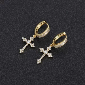 This Iced Cross Hanging Earring is the perfect fusion of style and spirituality. The gold-plated finish and diamond-simulated stones add a bold shine, while the cross design brings a deep symbolism. These earrings make a striking statement, ideal for those looking to add a touch of bling to their casual or formal look. Perfect for those who appreciate the finer details of Hip Hop style, these earrings bring a luxurious edge to any outfit.