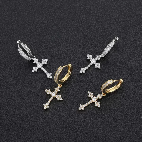 This Iced Cross Hanging Earring is the perfect fusion of style and spirituality. The gold-plated finish and diamond-simulated stones add a bold shine, while the cross design brings a deep symbolism. These earrings make a striking statement, ideal for those looking to add a touch of bling to their casual or formal look. Perfect for those who appreciate the finer details of Hip Hop style, these earrings bring a luxurious edge to any outfit.