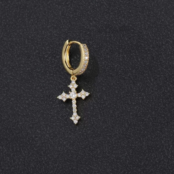 This Iced Cross Hanging Earring is the perfect fusion of style and spirituality. The gold-plated finish and diamond-simulated stones add a bold shine, while the cross design brings a deep symbolism. These earrings make a striking statement, ideal for those looking to add a touch of bling to their casual or formal look. Perfect for those who appreciate the finer details of Hip Hop style, these earrings bring a luxurious edge to any outfit.