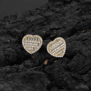 Spread the love with these Iced Heart Stud Earrings. The heart-shaped design, combined with the gold-plated finish and sparkling simulated diamonds, makes these earrings perfect for special occasions or just adding some romance to your everyday look. Whether you're dressing up or keeping it casual, these heart studs bring that Hip Hop charm with a touch of elegance.