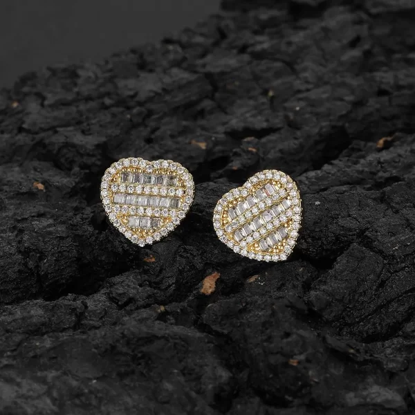 Spread the love with these Iced Heart Stud Earrings. The heart-shaped design, combined with the gold-plated finish and sparkling simulated diamonds, makes these earrings perfect for special occasions or just adding some romance to your everyday look. Whether you're dressing up or keeping it casual, these heart studs bring that Hip Hop charm with a touch of elegance.