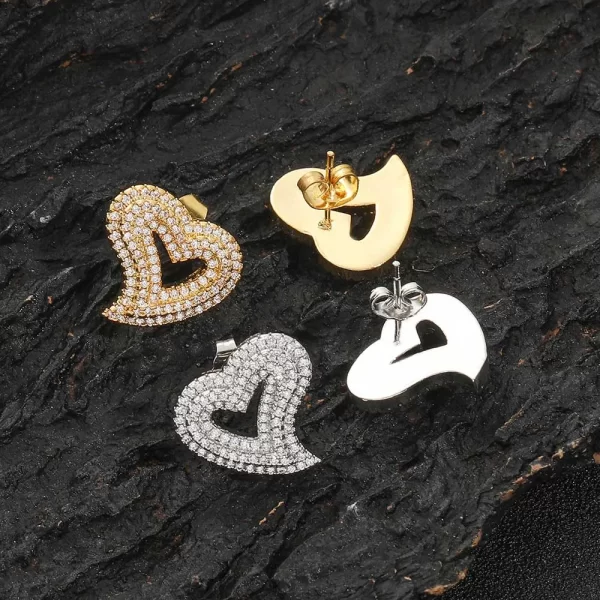 Express your love with the Iced Heart Stud Earring, featuring a delicate heart design adorned with diamond-simulated stones. The gold-plated finish ensures a lasting shine, while the sleek stud design keeps it comfortable for everyday wear or special occasions. This earring is perfect for those who want to add a bit of romantic flair to their Hip Hop style, making a bold yet elegant statement with every wear.