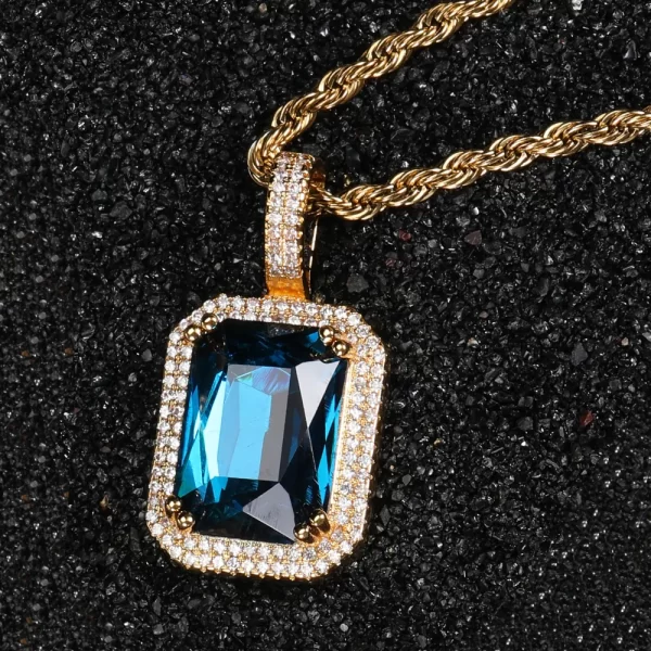 Embrace the calming beauty of the Yellow Gold Aquamarine Stone Pendant, featuring a serene blue aquamarine gemstone framed by VVS simulated diamonds. Set in a Yellow Gold-plated finish, this pendant is hypoallergenic and water-resistant, designed for both everyday wear and special occasions. The aquamarine’s light blue hue brings a refreshing touch to any look, making it a versatile piece for any jewelry lover who appreciates elegance with a Hip Hop twist.