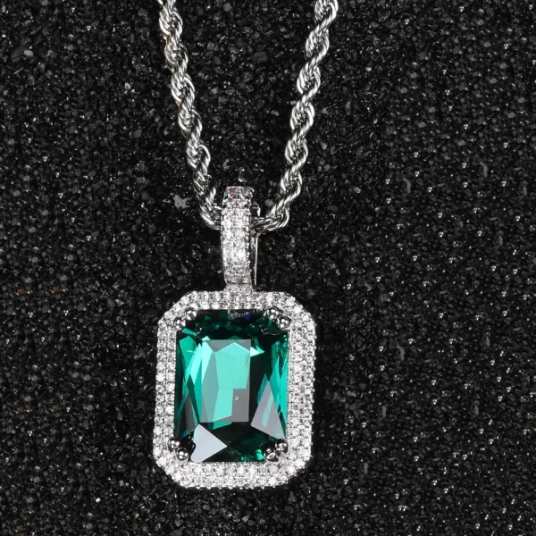 Bring a modern twist to your jewelry collection with the White Gold Emerald Stone Pendant. Featuring a radiant green emerald encased in VVS simulated diamonds, the White Gold-plated frame adds sleek sophistication to your look. Hypoallergenic and scratch-resistant, this pendant is built for long-lasting wear, making it perfect for casual or formal occasions. The cool White Gold finish enhances the stone’s brilliance, creating a standout accessory that blends Hip Hop flair with timeless elegance.