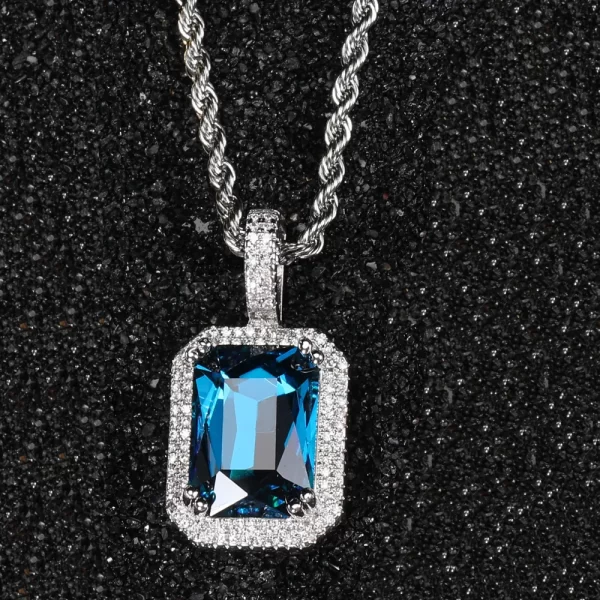 The White Gold Aquamarine Stone Pendant provides a fresh, modern feel to any outfit. Featuring a serene blue aquamarine gemstone surrounded by VVS simulated diamonds, the White Gold-plated finish adds a sleek, refined edge. Hypoallergenic and durable, this pendant is built for both everyday wear and special events. Whether you're dressing up or down, the cool tones of the aquamarine combined with the White Gold frame offer a balanced blend of elegance and Hip Hop style.