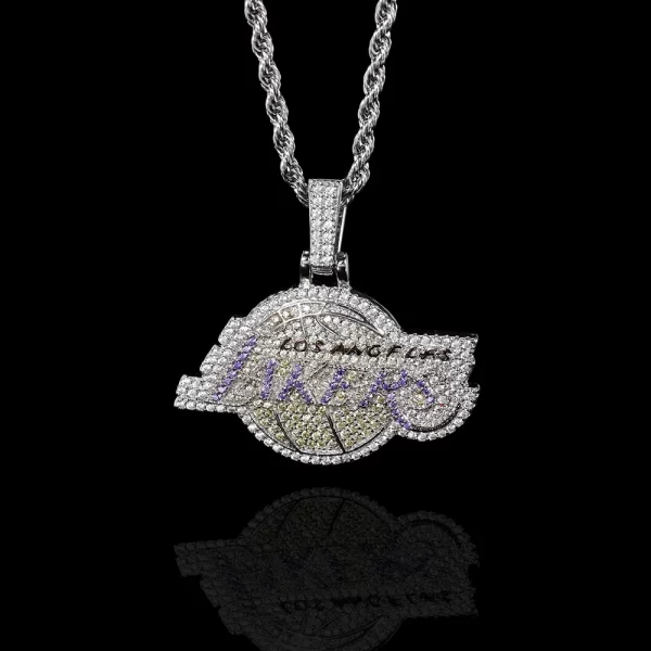 The White Gold Iced Lakers Pendant is a must-have for any basketball fan who wants to blend team pride with Hip-Hop fashion. This pendant showcases a striking Lakers logo encrusted with sparkling stones, set against a sleek White Gold finish. Hypoallergenic and waterproof, it's designed for both comfort and durability, making it ideal for everyday wear. Whether you're supporting your team or adding a stylish accessory to your look, this pendant shines bright, capturing the essence of both sports and Hip-Hop culture.