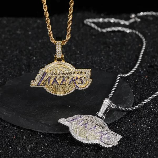 The White Gold Iced Lakers Pendant is a must-have for any basketball fan who wants to blend team pride with Hip-Hop fashion. This pendant showcases a striking Lakers logo encrusted with sparkling stones, set against a sleek White Gold finish. Hypoallergenic and waterproof, it's designed for both comfort and durability, making it ideal for everyday wear. Whether you're supporting your team or adding a stylish accessory to your look, this pendant shines bright, capturing the essence of both sports and Hip-Hop culture.