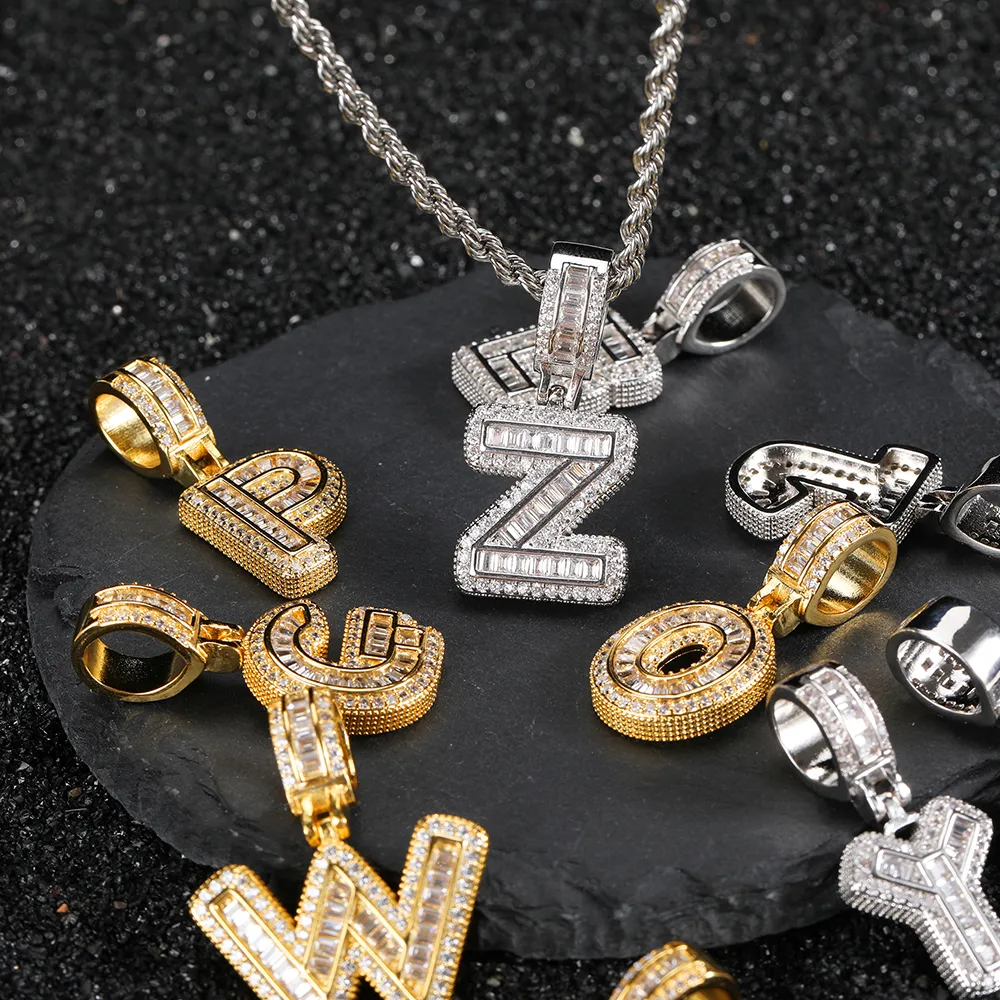 Showcase your personal style with the White Gold Iced Letter Pendant. This modern piece is plated in White Gold and adorned with VVS simulated diamonds, giving it an extra pop of shine. Hypoallergenic and built for everyday wear, this pendant offers a fresh twist on classic Hip Hop aesthetics. Whether you’re looking to make your outfit stand out or gift someone special, the White Gold finish adds an elegant touch, ensuring this piece is perfect for both casual and formal occasions.