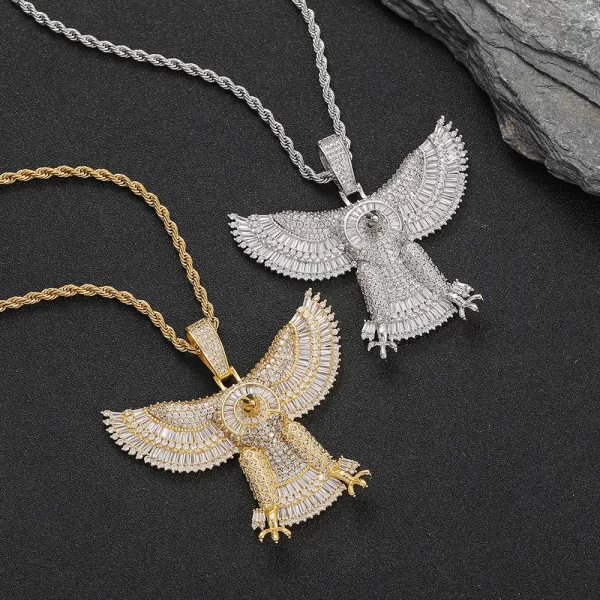 The Iced Eagle Pendant in White Gold offers a sleek, modern twist on a classic symbol of power. Featuring intricate diamond detailing and a high-shine white gold finish, it’s both hypoallergenic and waterproof, making it perfect for daily wear. This pendant is ideal for those who love to combine luxury with a strong, bold statement in true Hip Hop fashion.