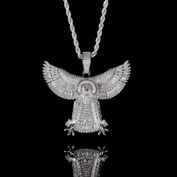 The Iced Eagle Pendant in White Gold offers a sleek, modern twist on a classic symbol of power. Featuring intricate diamond detailing and a high-shine white gold finish, it’s both hypoallergenic and waterproof, making it perfect for daily wear. This pendant is ideal for those who love to combine luxury with a strong, bold statement in true Hip Hop fashion.