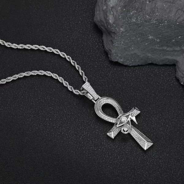 In White Gold, the Eye of Ra Ankh Cross Pendant offers a stunning combination of ancient symbolism and modern flair. This pendant is encrusted with VVS simulated diamonds, giving it a radiant sparkle that shines in any light. The White Gold plating provides a sleek and refined touch, perfect for daily wear or special events. Its hypoallergenic, waterproof, and scratch-resistant properties make it as durable as it is stylish. Whether you're honoring ancient culture or adding a unique element to your Hip-Hop style, this pendant is a must-have for any jewelry collection.