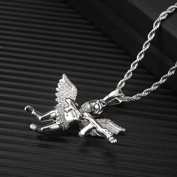 The White Gold Revenge Angel Pendant embodies both elegance and power. Its angel wing design, crafted from white gold plating, ensures hypoallergenic and waterproof durability. Ideal for adding a unique Hip Hop touch to any outfit.