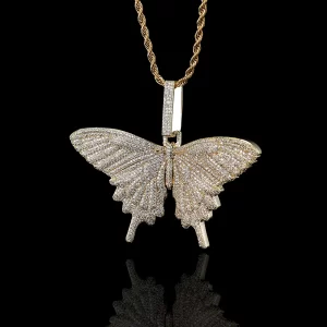 This Iced Butterfly Pendant in Yellow Gold adds a touch of elegance and whimsy to your look. Crafted with a durable Yellow Gold-plated finish and encrusted with shimmering stones, it captures the delicate beauty of a butterfly. Hypoallergenic, waterproof, and scratch-resistant, this pendant is built for everyday wear, blending both sophistication and playful charm. Whether for personal wear or gifting, it’s a standout piece for those who appreciate unique, iced-out jewelry with a distinct Hip Hop flavor.