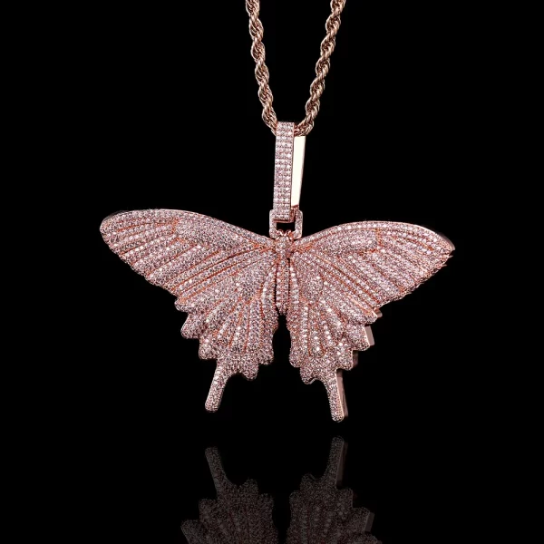 The Iced Butterfly Pendant in Rose Gold adds a soft, romantic touch to your collection. The warm Rose Gold plating complements the shimmering stones, creating a beautiful contrast that brings out the delicate butterfly design. Hypoallergenic, waterproof, and scratch-resistant, this pendant is designed for everyday wear, combining elegance with durability. Ideal for those who love timeless, feminine pieces with a modern Hip Hop edge, it’s a perfect choice for any occasion.