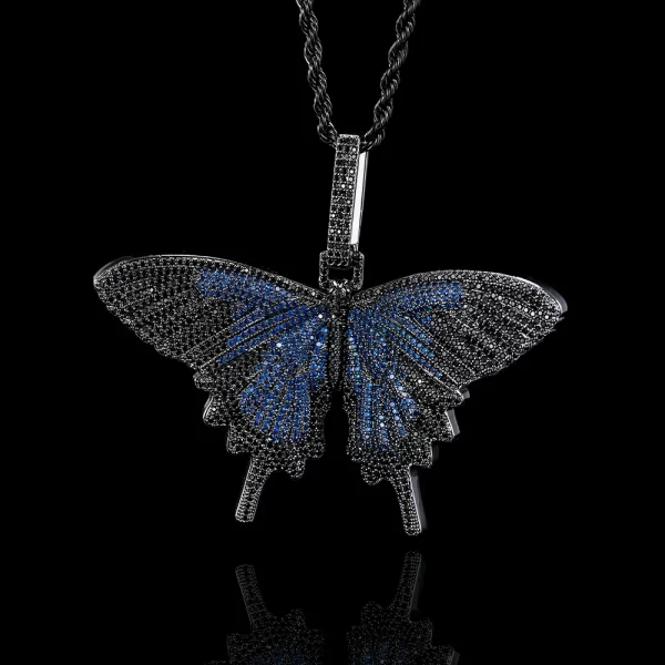 The Iced Butterfly Pendant in Dark Blue brings a bold and enchanting twist to a delicate design. The rich Dark Blue hue is accentuated by shimmering stones, capturing the beauty and grace of a butterfly in flight. Hypoallergenic, waterproof, and scratch-resistant, this pendant is designed for daily wear while maintaining its striking brilliance. Whether it’s for personal wear or a unique gift, this Dark Blue butterfly pendant adds a hint of mystery and elegance, perfect for anyone who loves Hip Hop jewelry with a vibrant, standout look.