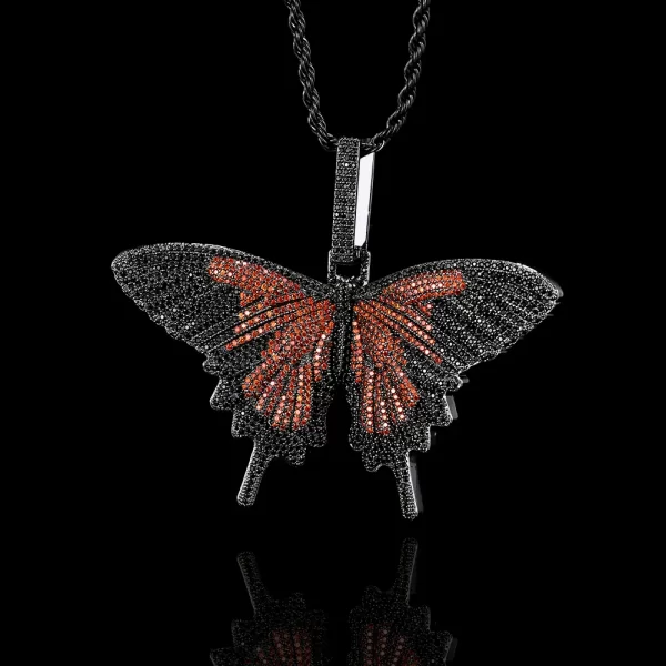 The Iced Butterfly Pendant in Dark Red offers a rich and vibrant color palette that adds a touch of passion to any outfit. The Dark Red plating enhances the butterfly design, while the sparkling stones provide an eye-catching shine. This pendant is hypoallergenic, waterproof, and scratch-resistant, ensuring it remains beautiful through daily wear. Perfect for those who love bold, expressive jewelry with a hint of Hip Hop culture, this pendant adds a unique flair to any collection.