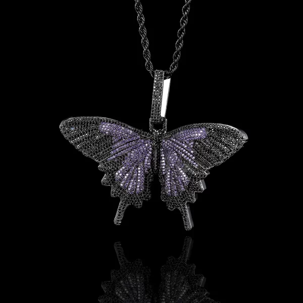 The Iced Butterfly Pendant in Dark Purple offers a striking and luxurious touch to your jewelry collection. The Dark Purple plating is paired with sparkling stones that shimmer in any light, creating a captivating contrast. This pendant is hypoallergenic, waterproof, and scratch-resistant, making it suitable for everyday wear. Its unique color and design make it ideal for those who appreciate bold, eye-catching accessories with a playful Hip Hop vibe.