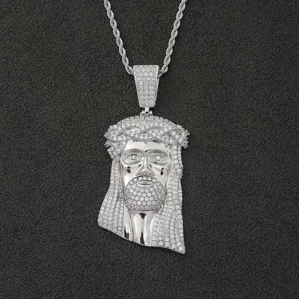 The White Gold Iced Jesus Pendant offers a sleek, polished look with a blend of faith and modern Hip-Hop style. Adorned with VVS simulated diamonds, this pendant shines with a luxurious and reflective surface. Its hypoallergenic and waterproof design makes it perfect for everyday wear. The White Gold finish adds a sophisticated edge to its bold design, ensuring it stands out whether worn solo or layered with other chains. Durable and scratch-resistant, this pendant is built to last, making it a meaningful and stylish accessory for any jewelry collection.