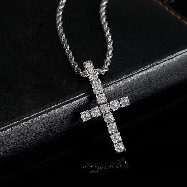 The Iced Prong Cross Pendant in White Gold is a 21mm piece of luxurious craftsmanship, featuring VVS simulated diamonds set in a white gold-plated finish. Hypoallergenic and waterproof, it offers both durability and elegance, making it perfect for daily wear. Whether as a meaningful gift or a stylish addition to your jewelry collection, this pendant blends faith and Hip Hop fashion effortlessly, adding a bold yet spiritual touch to any outfit.