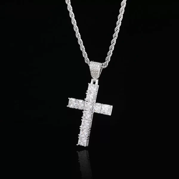 he Iced Prong Cross Pendant in White Gold offers a sleek and modern twist on the classic cross design, encrusted with VVS simulated diamonds for maximum shine. The White Gold plating adds an extra touch of refinement, making it perfect for anyone wanting to embrace both faith and urban luxury. Durable, waterproof, and hypoallergenic, this piece is built to last through any occasion, whether you¡¯re out at a formal event or rocking your hip-hop style daily. This iced pendant is the perfect finishing touch for any bold and stylish look.