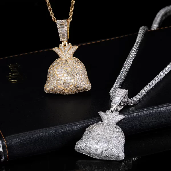 The Iced Money Bag Pendant in White Gold is a stylish representation of success and ambition. Designed with a White Gold-plated finish and encrusted with sparkling stones, this pendant is a luxurious accessory for everyday wear or special occasions. Hypoallergenic, waterproof, and scratch-resistant, it’s built to withstand the rigors of daily use. Perfect for adding a touch of wealth-inspired flair to any look, this pendant is ideal for those who appreciate Hip-Hop style and the symbolism of financial success.