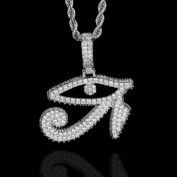 The Iced Eye of Ra Pendant in White Gold delivers a sleek, modern twist to this ancient symbol. Highlighted by glittering stones, the White Gold finish complements the bold design, making it a standout piece in any jewelry collection. Hypoallergenic, waterproof, and durable, it’s designed for daily wear, blending the symbolism of the Eye of Ra with contemporary Hip Hop style.