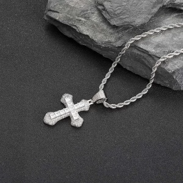 The White Gold Iced Baguette Cross Pendant is a modern expression of faith and style. Featuring baguette-cut simulated diamonds, this cross-shaped pendant is plated in White Gold, offering a sleek and contemporary look. Hypoallergenic and crafted for long-lasting wear, this piece combines bold Hip Hop fashion with spiritual significance. Whether dressing up for an event or adding a spiritual touch to casual wear, the White Gold finish ensures this pendant remains a standout accessory.