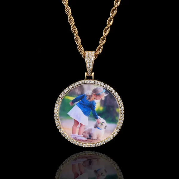 Create a lasting memory with the Custom Picture Pendant in Yellow Gold. This 45mm pendant offers a circular frame for displaying your favorite photo, making it a personal and meaningful accessory. The Yellow Gold plating provides a high-end finish, while the hypoallergenic and waterproof features ensure comfort and durability for everyday wear. Scratch-resistant, it¡¯s built to withstand daily use while maintaining its luxurious shine. Whether as a gift or personal keepsake, this pendant offers the perfect balance of sentimental value and stylish Hip-Hop flair.