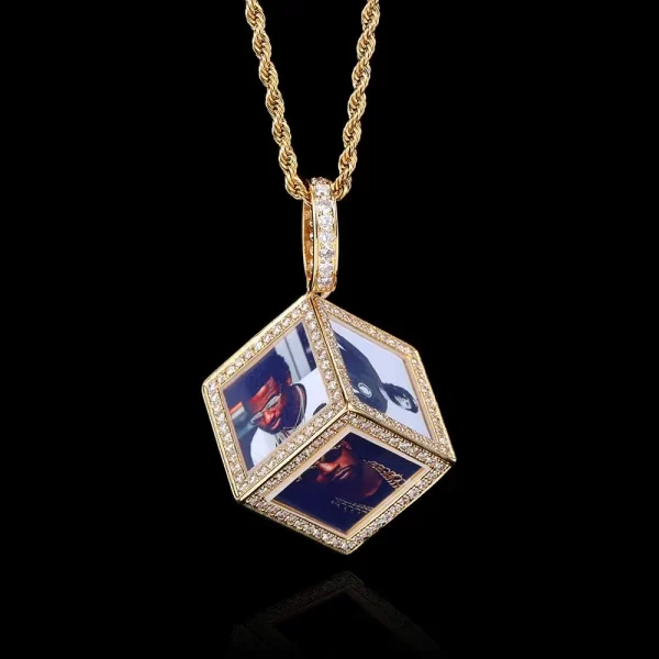 The Yellow Gold Custom Cube Picture Pendant brings a modern and fun twist to personalized jewelry. This 37mm cube-shaped pendant allows you to display multiple photos in a stylish Yellow Gold-plated frame, surrounded by VVS simulated diamonds for extra shine. Hypoallergenic and durable, it¡¯s designed for everyday wear or special occasions. The Yellow Gold finish adds warmth and elegance to this unique accessory, making it a standout piece for those who love to express themselves through their jewelry in true Hip Hop style.