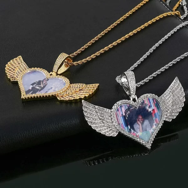 Cherish your memories with this Custom Angel Wing Heart Picture Pendant, a 75mm piece that adds both elegance and sentimentality to your collection. The Yellow Gold-plated heart is accented by angel wings, providing a special place for your cherished image. Hypoallergenic, waterproof, and scratch-resistant, this pendant is designed for durability and daily wear. Whether as a gift or personal keepsake, the pendant combines emotional significance with high-end style, making it perfect for those who love Hip Hop jewelry with a personal touch.