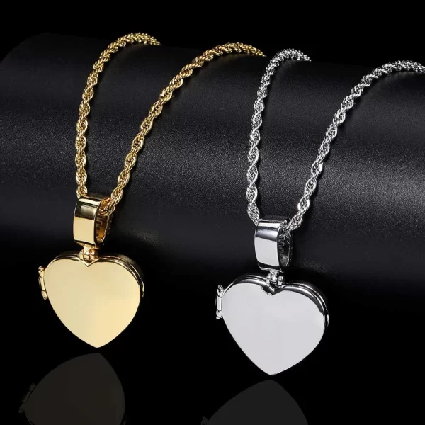 Show your love in a unique way with the Custom Iced Flip Cover Heart Pendant in Yellow Gold. This 31mm heart-shaped pendant is adorned with shimmering VVS simulated diamonds, adding a luxurious sparkle to your jewelry collection. The flip cover design lets you reveal a hidden photo or message inside, making it the perfect personal keepsake. The Yellow Gold plating ensures it stands out, while the hypoallergenic and waterproof features guarantee lasting durability and comfort. Whether you're gifting it to someone special or wearing it yourself, this piece is a symbol of love and style in the world of hip-hop fashion.