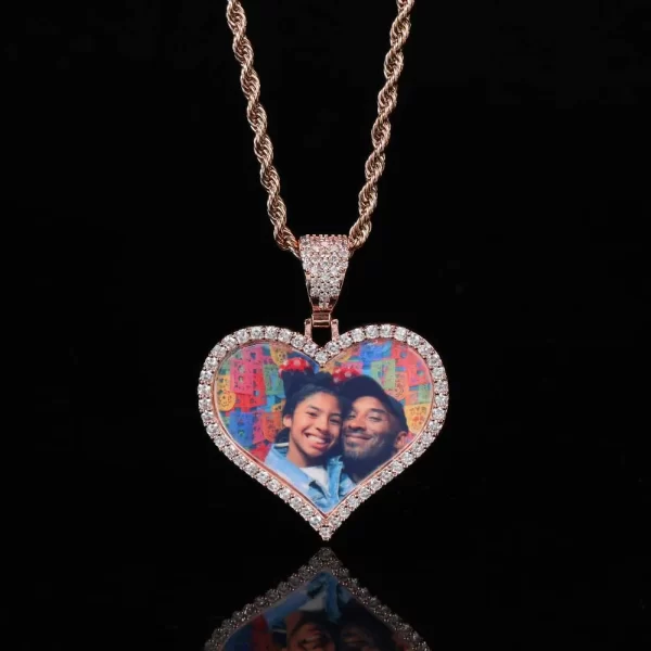 For a more unique and stylish touch, the Rose Gold Custom Heart Picture Pendant brings warmth and romance to this personalized accessory. The 39mm heart-shaped pendant, framed in Rose Gold-plated metal and adorned with VVS simulated diamonds, allows you to showcase your cherished photos in a sentimental yet stylish way. Hypoallergenic and waterproof, it¡¯s built for daily wear or special events, adding a refined and romantic element to your Hip Hop look.