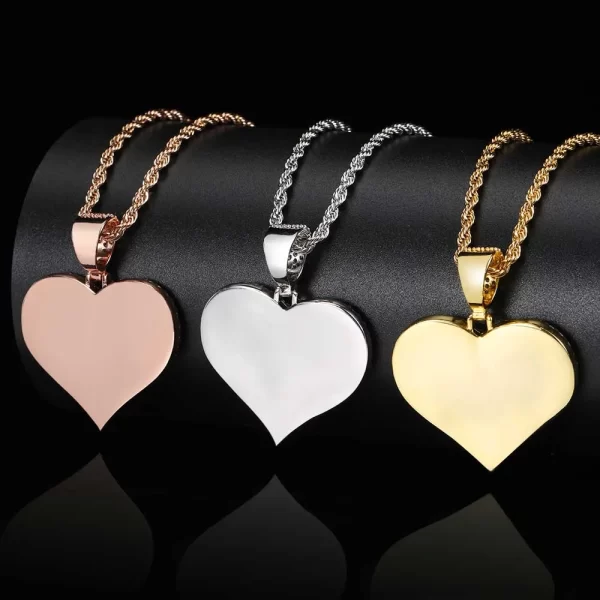 The Yellow Gold Custom Heart Picture Pendant offers a sentimental touch to your Hip Hop jewelry collection. Featuring a 39mm heart-shaped pendant framed in Yellow Gold-plated metal, this piece allows you to display your personal photos surrounded by VVS simulated diamonds. Hypoallergenic, scratch-resistant, and waterproof, this pendant is perfect for daily wear or special occasions. Whether gifting or keeping it as a cherished memory, the Yellow Gold finish adds warmth and elegance to this unique, personal accessory.