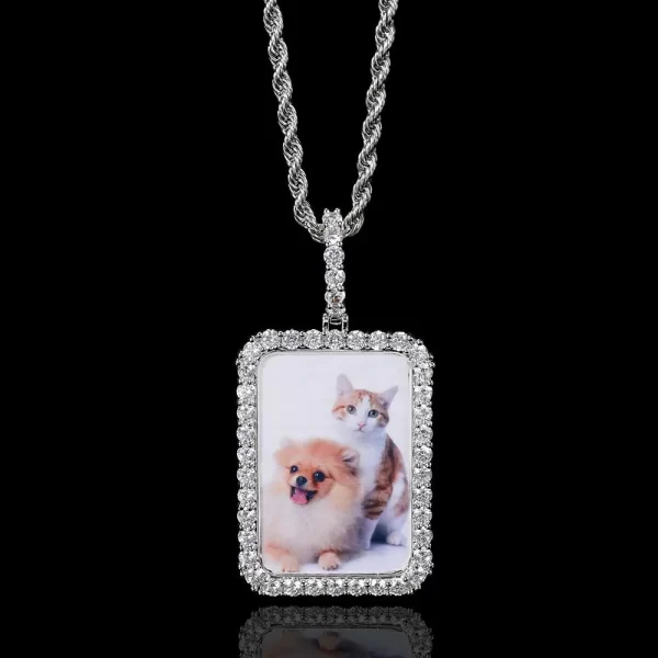 The Custom Square Picture Pendant in White Gold, measuring 40mm, offers a sleek way to carry a cherished memory with you. Its White Gold-plated finish gives it a refined look, while the hypoallergenic and waterproof design ensures durability. Ideal for gifting or personal use, this pendant blends sentimentality with Hip-Hop style, making it an elegant addition to any jewelry collection. Whether worn daily or for special occasions, it’s a unique way to keep treasured moments close.