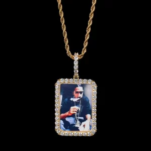 Keep your favorite memories close with this Custom Square Picture Pendant, measuring 40mm. Crafted with a Yellow Gold-plated finish, this pendant is both stylish and sentimental. It features a customizable area where you can insert a picture, making it a perfect gift for a loved one or a personal keepsake. The hypoallergenic and waterproof design ensures it can be worn every day without worry, while its scratch-resistant surface guarantees it stays pristine. A modern take on timeless elegance, this pendant is a unique way to express love and memory in one.