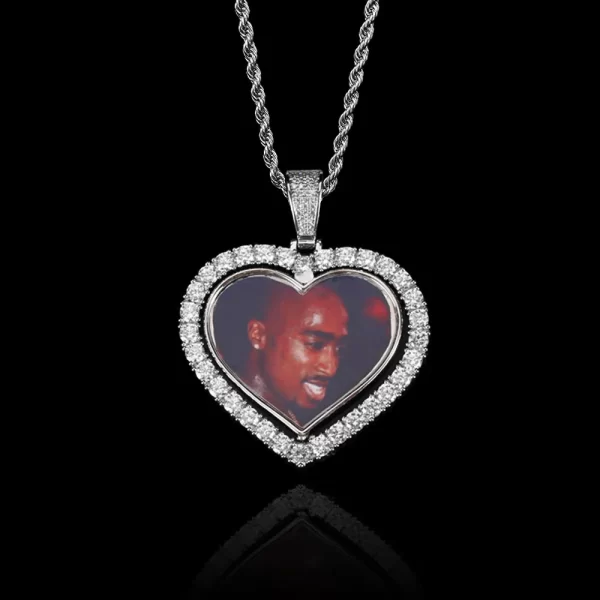 The White Gold Custom 3D Spinner Heart Picture Pendant offers a sleek and modern way to showcase two cherished photos. Framed in White Gold-plated metal and accented with VVS simulated diamonds, this 48mm pendant features a unique rotating design. Hypoallergenic, waterproof, and scratch-resistant, it¡¯s perfect for daily wear or special events. The White Gold finish adds a cool elegance to this personalized piece, making it a standout in any Hip Hop jewelry collection.