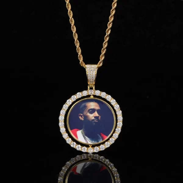 Customize your Hip Hop look with the Yellow Gold Custom 3D Spinner 2-sided Picture Pendant. This 42mm pendant allows you to display your favorite photos on both sides, featuring a unique spinning mechanism. Plated in Yellow Gold and adorned with VVS simulated diamonds, it delivers both style and personalization. The hypoallergenic and durable design makes this pendant perfect for daily wear or special occasions, ensuring your memories are displayed in luxury. Whether for yourself or as a thoughtful gift, the Yellow Gold finish adds an elegant touch.