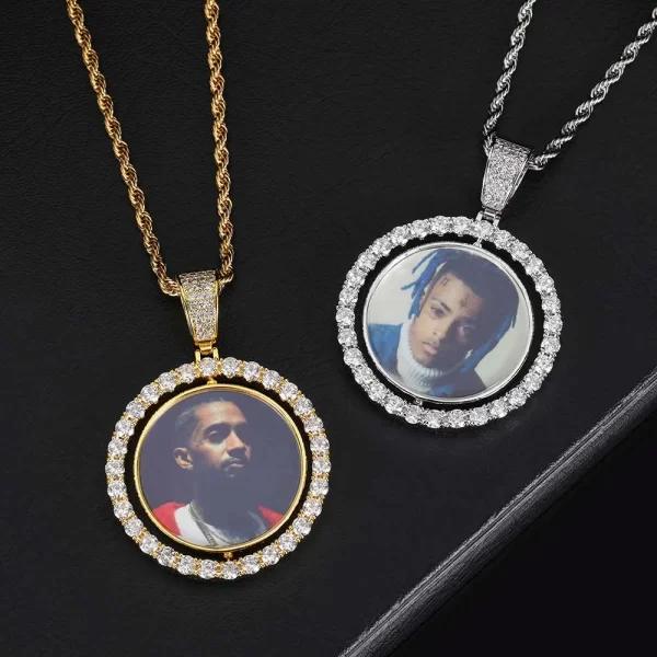 Add a personalized touch to your jewelry with the White Gold Custom 3D Spinner 2-sided Picture Pendant. This 42mm pendant features a spinning mechanism, allowing you to showcase photos on both sides. The White Gold finish, combined with VVS simulated diamonds, ensures it remains a standout piece in your Hip Hop wardrobe. Hypoallergenic and built for durability, this pendant is perfect for adding a unique twist to casual or formal outfits, making it a meaningful and stylish accessory.