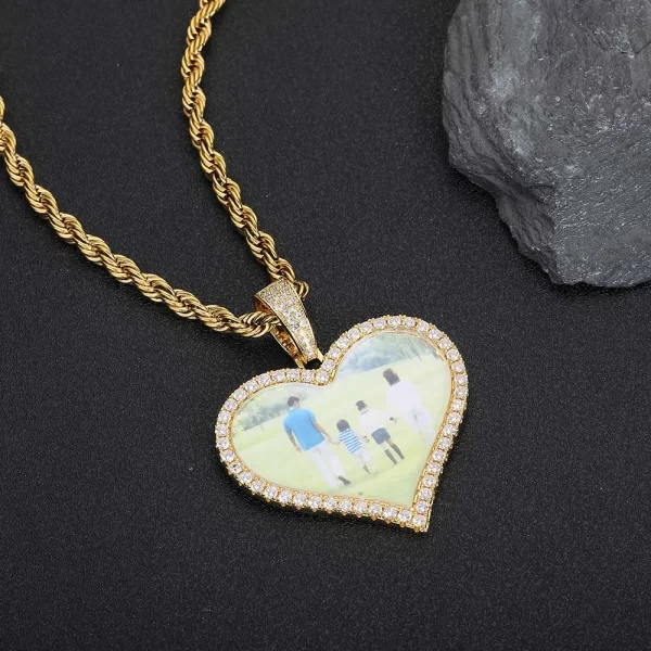 Celebrate your most cherished moments with this Custom Heart Picture Pendant, measuring 50mm. The large heart-shaped frame is perfect for showcasing a special photo that holds sentimental value. Yellow Gold-plated for a luxurious finish, this pendant is hypoallergenic, waterproof, and scratch-resistant, ensuring it remains a long-lasting keepsake. Whether for everyday wear or a special gift, this pendant captures both elegance and personal significance in one beautiful piece. A perfect token of love for anniversaries, Valentine’s Day, or any meaningful occasion.