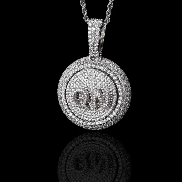 The White Gold Custom Spinner Letter Pendant is the ultimate personalized statement piece. Measuring 43mm, this pendant features a unique rotating letter at its center, giving you a fun and bold way to express your style. The White Gold plating adds a sophisticated touch, while the VVS simulated diamonds ensure that it sparkles from every angle. Waterproof and scratch-resistant, this piece is perfect for those who want to bring a bit of hip-hop flair into their everyday look without sacrificing durability or style.