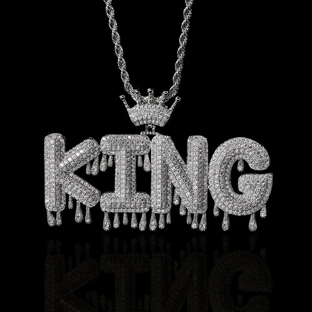 The Custom Royal Droplets Letter Pendant in White Gold offers a modern yet regal twist. Featuring letter customization and delicate droplet accents, it’s perfect for making a bold statement. Hypoallergenic, waterproof, and scratch-resistant, this pendant is designed for everyday wear while adding a touch of Hip Hop royalty to any outfit.